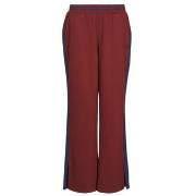 Jogging housut / Ulkoiluvaattee New Balance  POST SEASON PIQUE TRACK J...