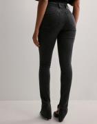 Calvin Klein Jeans - Musta - High Rise Super Skinny