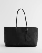 Nelly - Musta - The Nylon Shopper